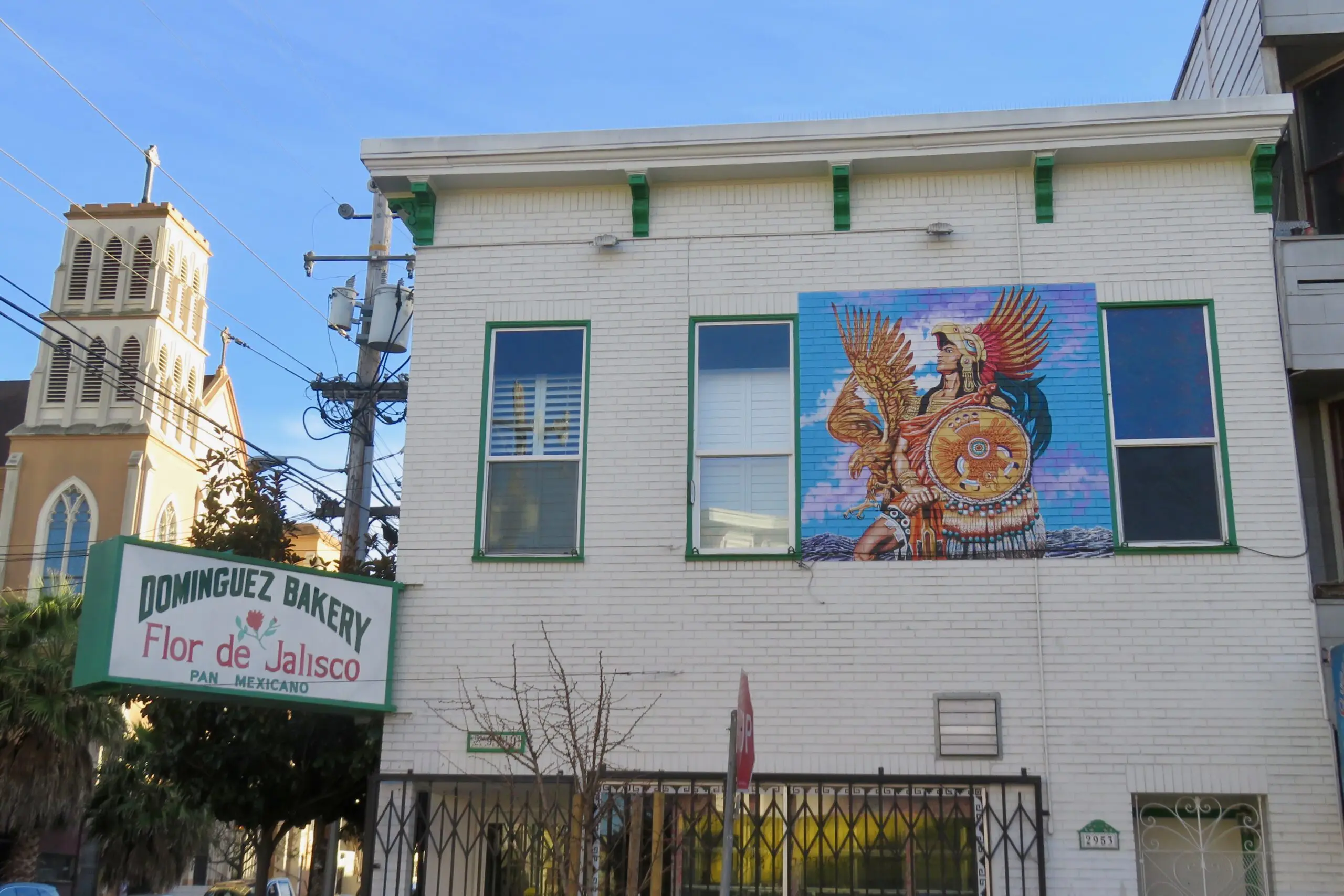 Murals covering garage doors and walls in Balmy Alley in the Mission District - San Francisco