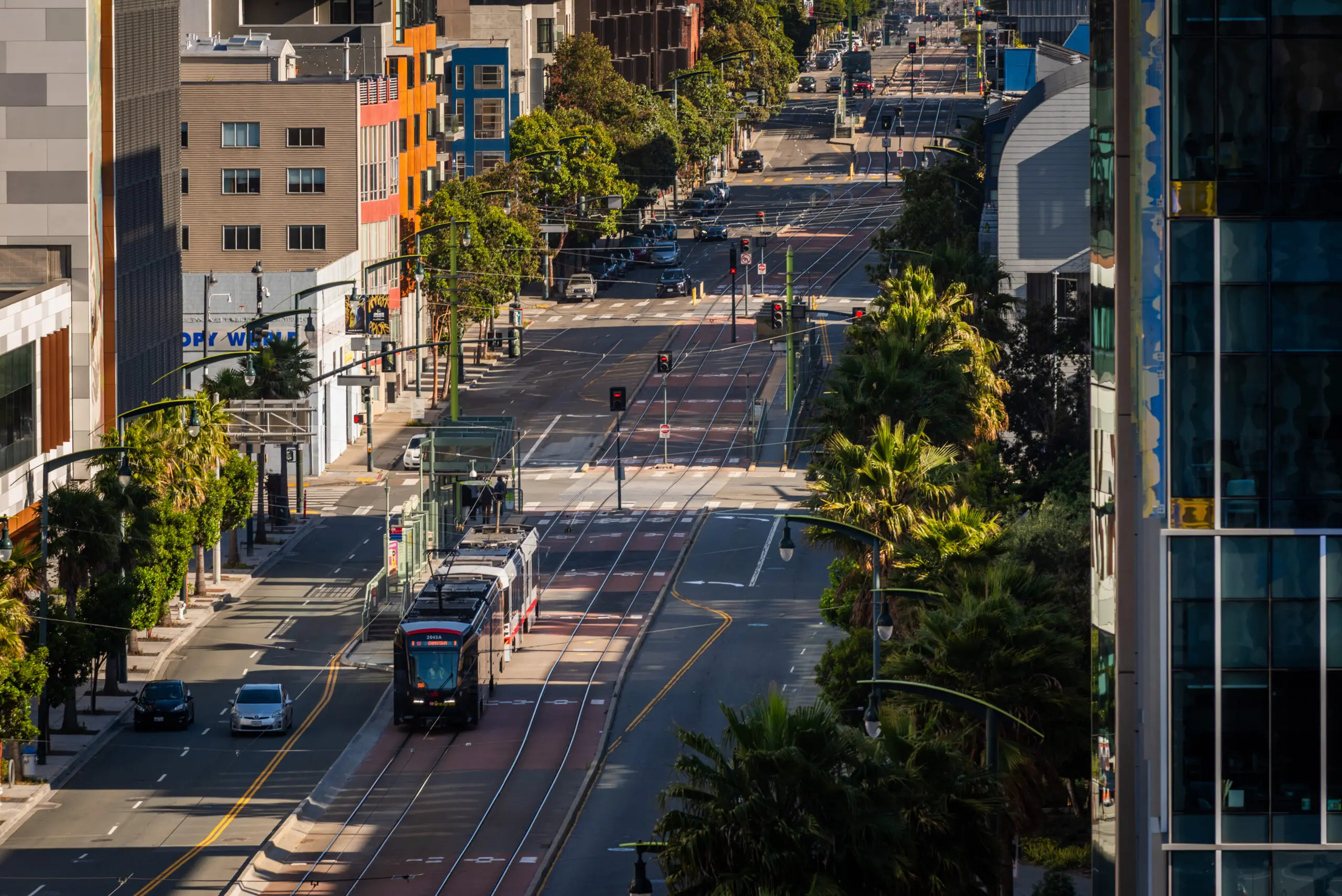 A Muni T Third Street light rail train departing UCSF Medical Center Station in Mission Bay - San Francisco