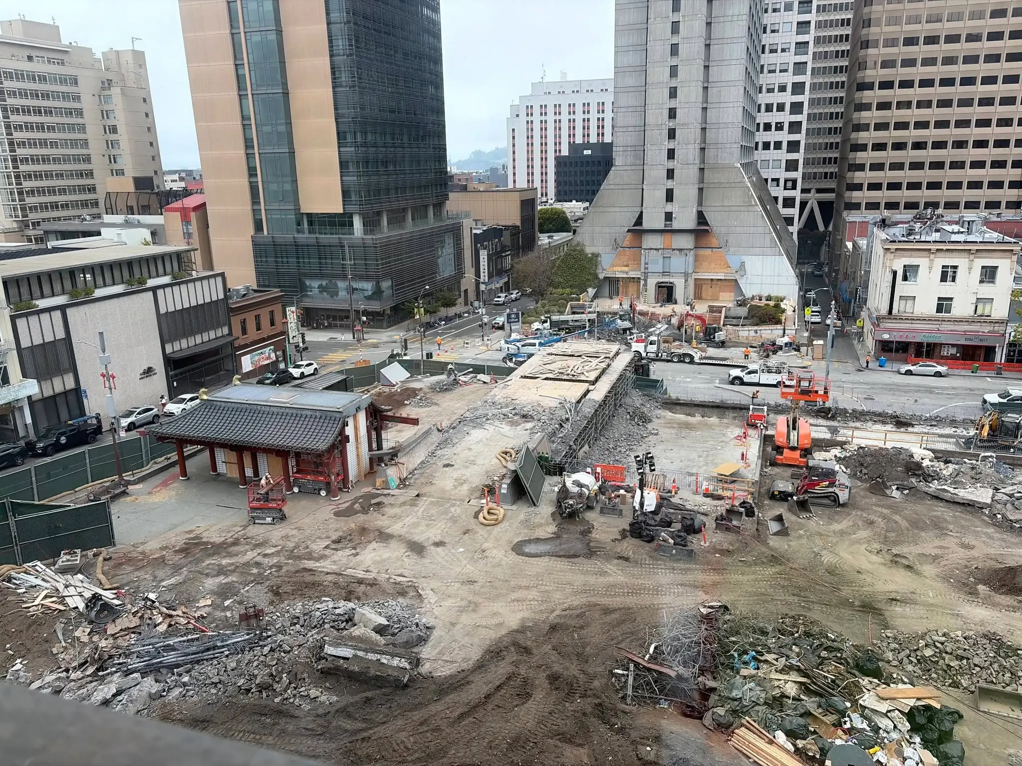 Crews demolishing the Kearny Street pedestrian bridge at Portsmouth Square in Chinatown - San Francisco