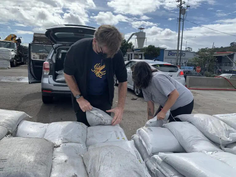 Residents loading free sandbags into a car at the San Francisco Public Works operations yard - San Francisco