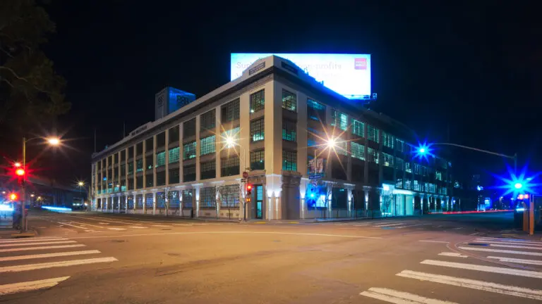 The office building at 888 Brannan Street in SoMa at night, where tech leasing is driving down office vacancy - San Francisco
