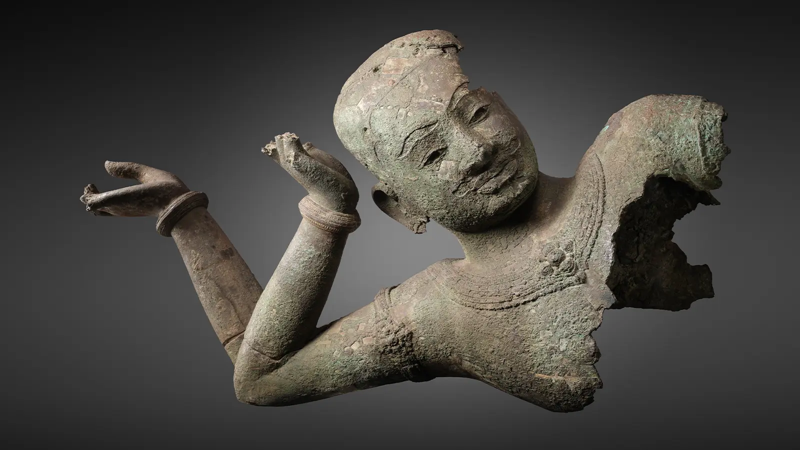 Bronze head and torso of the Reclining Vishnu of West Mebon from Angkor, Cambodia, shown in Vishnu's Cosmic Ocean at the Asian Art Museum - San Francisco